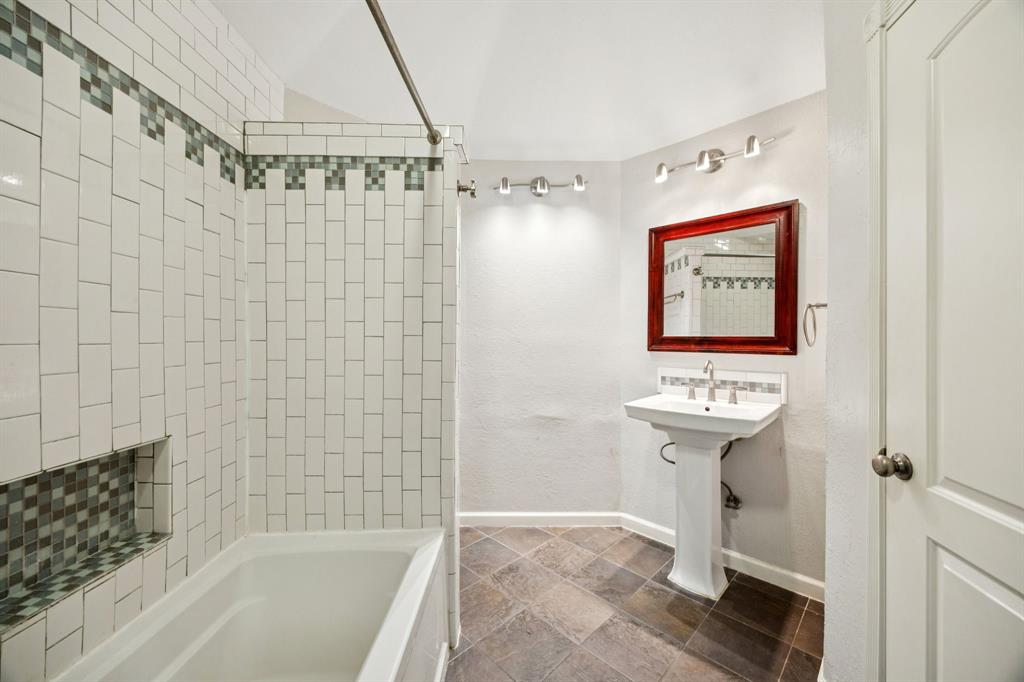 18111 Whispering Gables Lane Dallas, TX 75287 - Photo 10 of 15 a bathroom with a shower and a sink