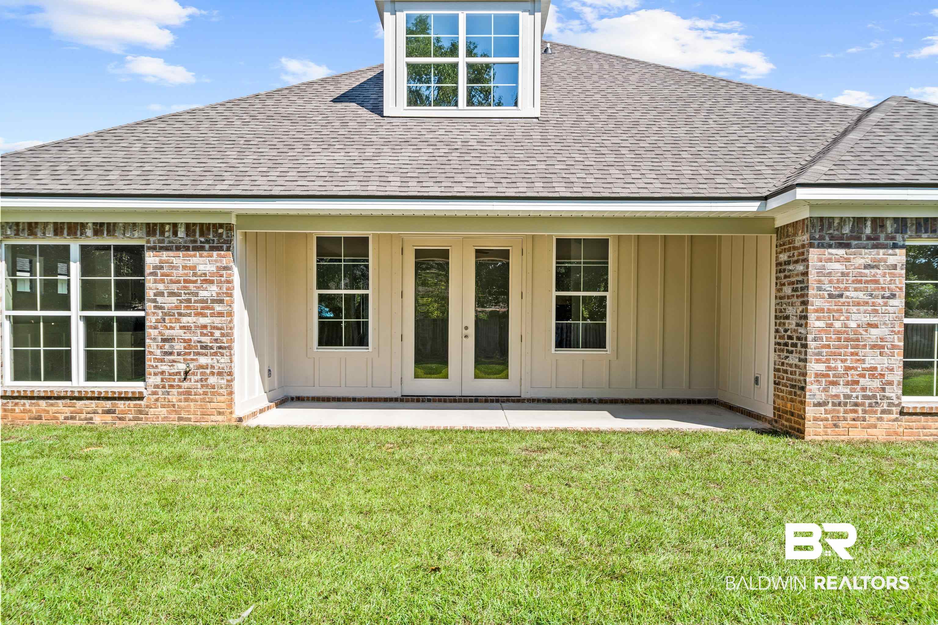 25927 Capra Court Daphne, AL 36526 - Photo 30 of 37 Rear view of property with a patio, french doors, and a yard