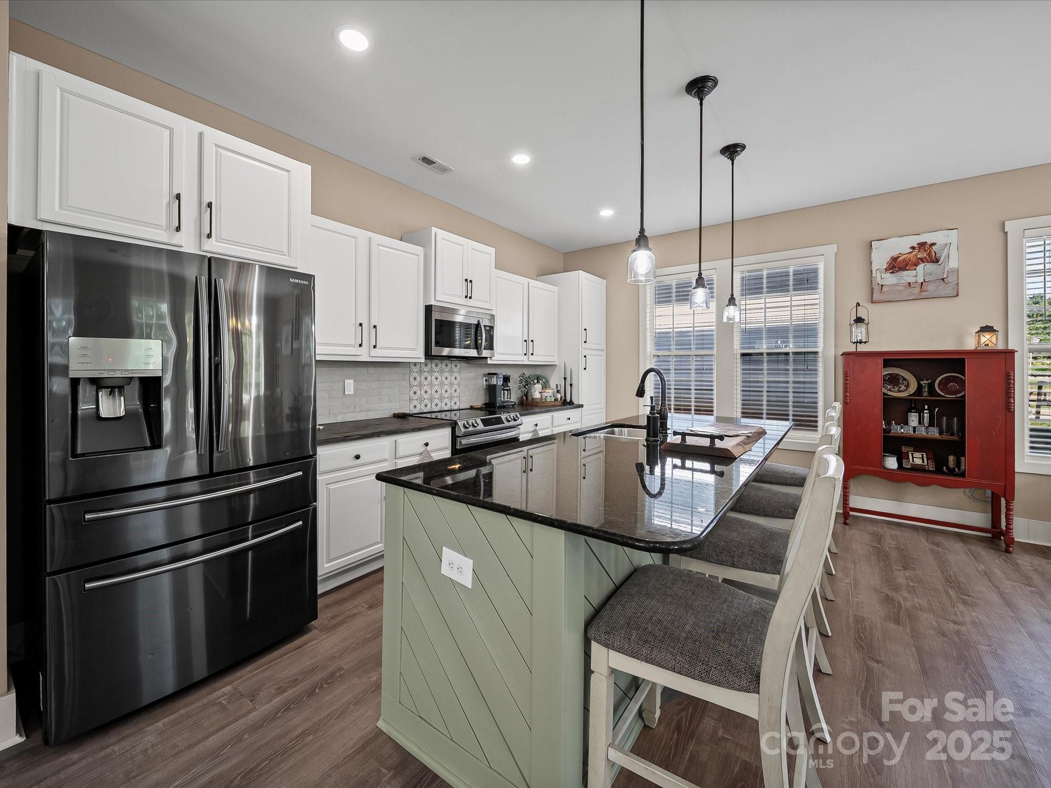 28117 Egrets Court Lancaster, SC 29720 - Photo 11 of 46 a kitchen with stainless steel appliances granite countertop a refrigerator a stove sink and cabinets