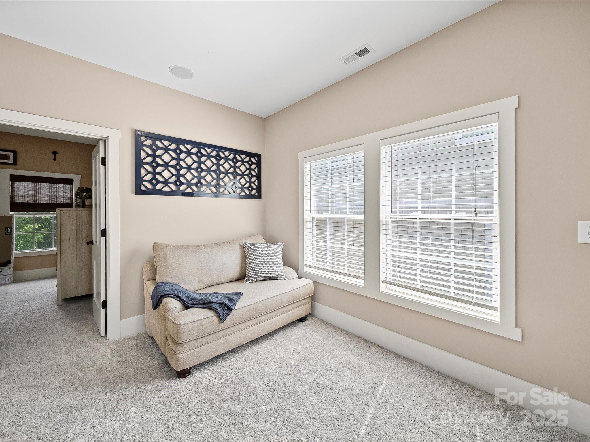 28117 Egrets Court Lancaster, SC 29720 - Photo 19 of 46 a living room with furniture and a large window