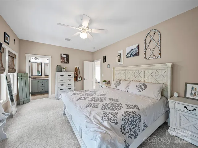 an aerial view of a house with swimming pool and garden