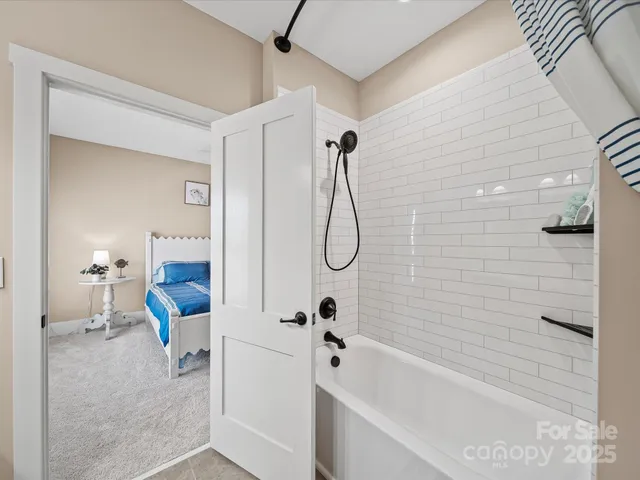 an aerial view of residential house with swimming pool and lawn chairs