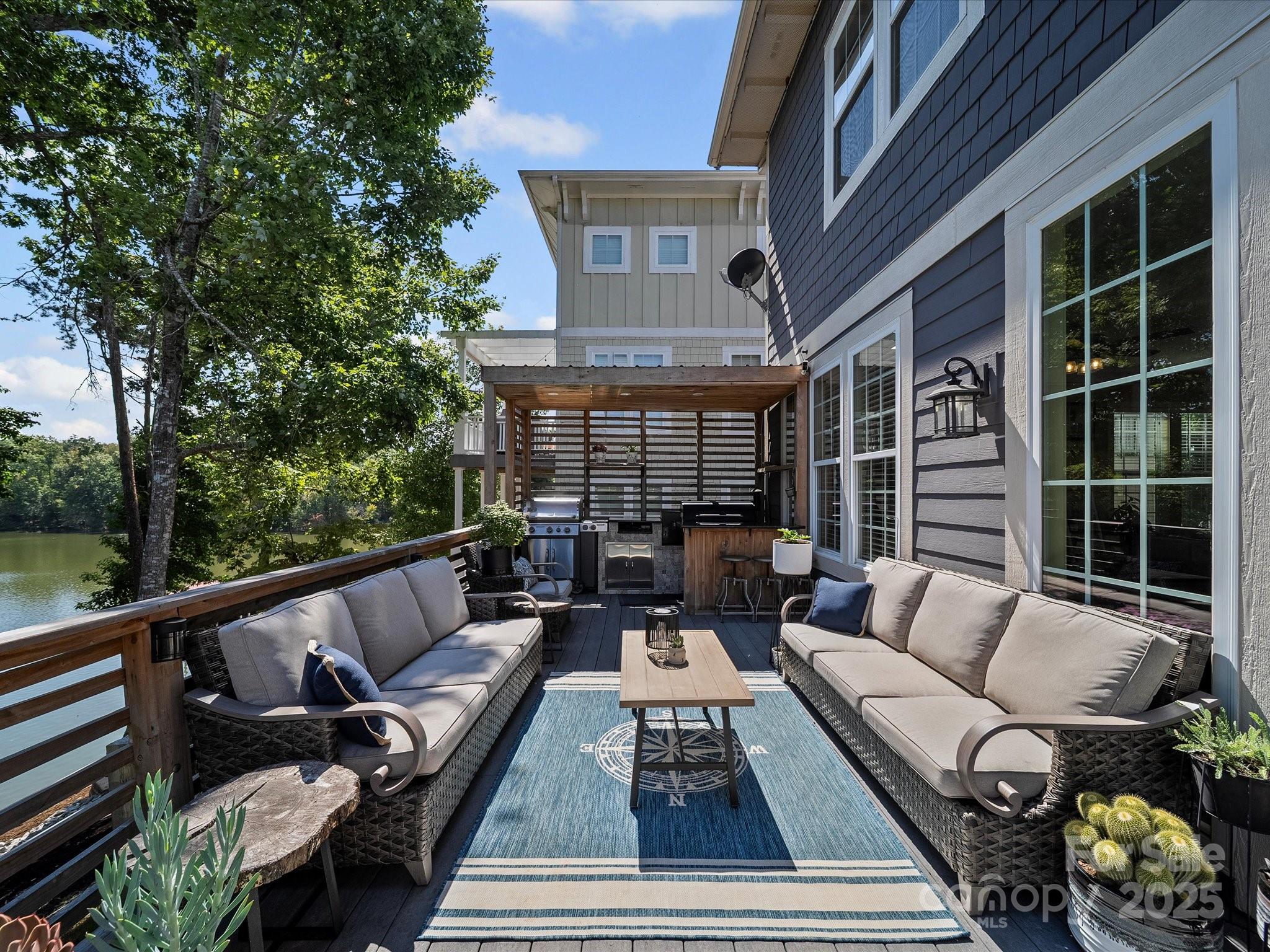 28117 Egrets Court Lancaster, SC 29720 - Photo 33 of 46 a roof deck with couches and a potted plant on a table with garden view
