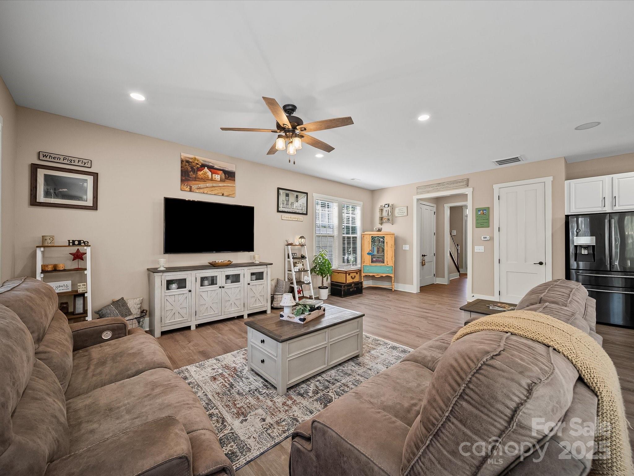 28117 Egrets Court Lancaster, SC 29720 - Photo 4 of 46 a living room with furniture and a flat screen tv