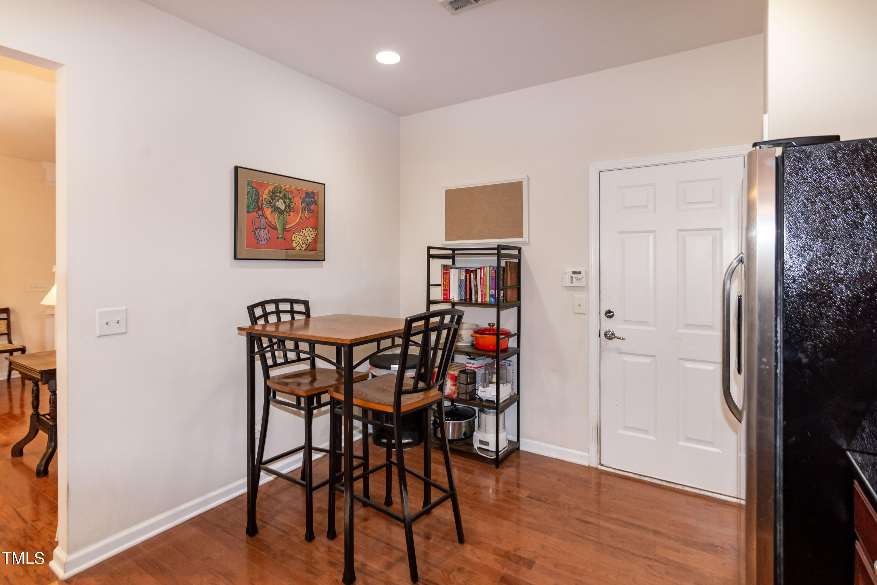 8621 Thunderwood Drive Raleigh, NC 27617 - Photo 11 of 35 a view of a livingroom with furniture and wooden floor