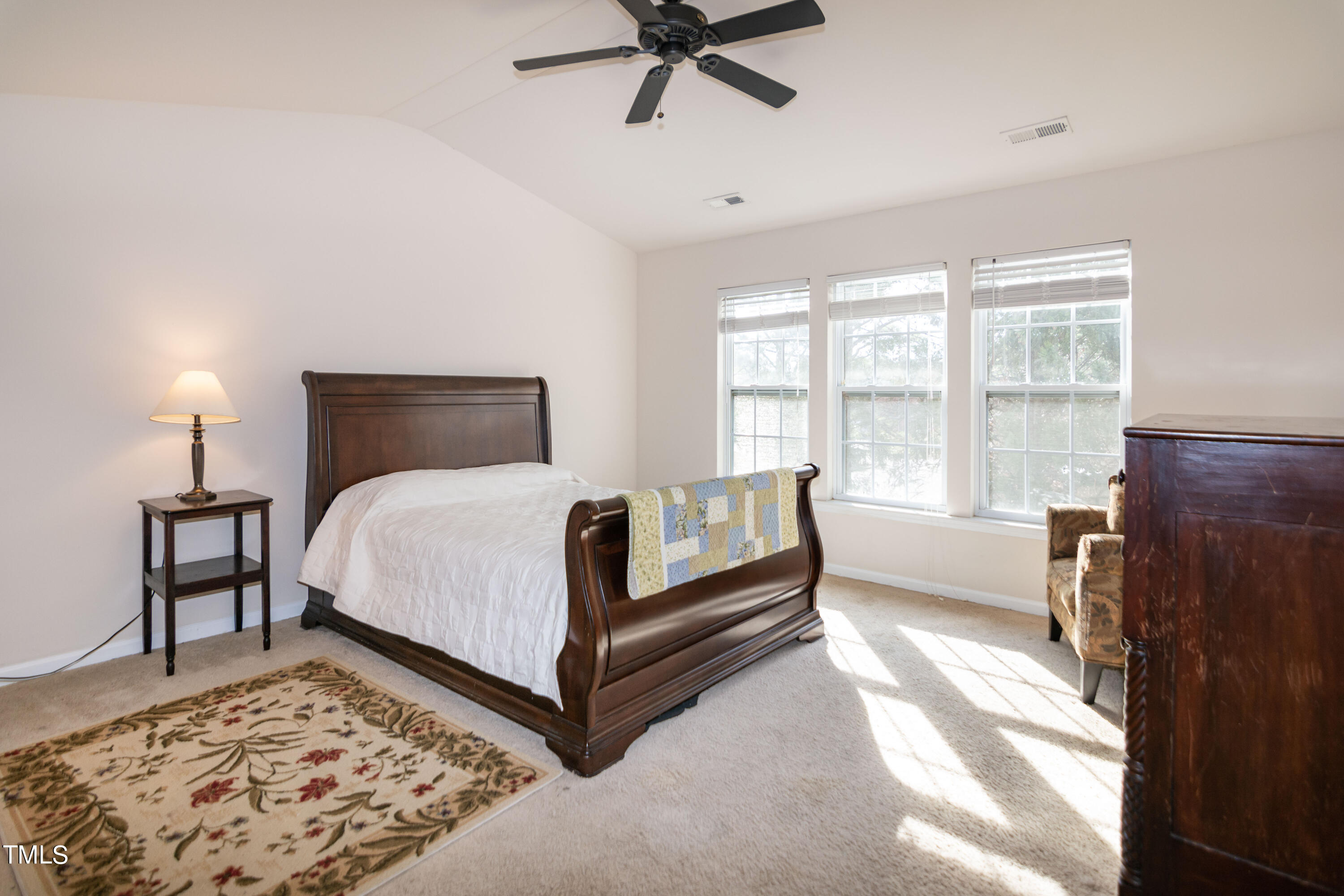 8621 Thunderwood Drive Raleigh, NC 27617 - Photo 16 of 35 a bed room with a bed and a couch
