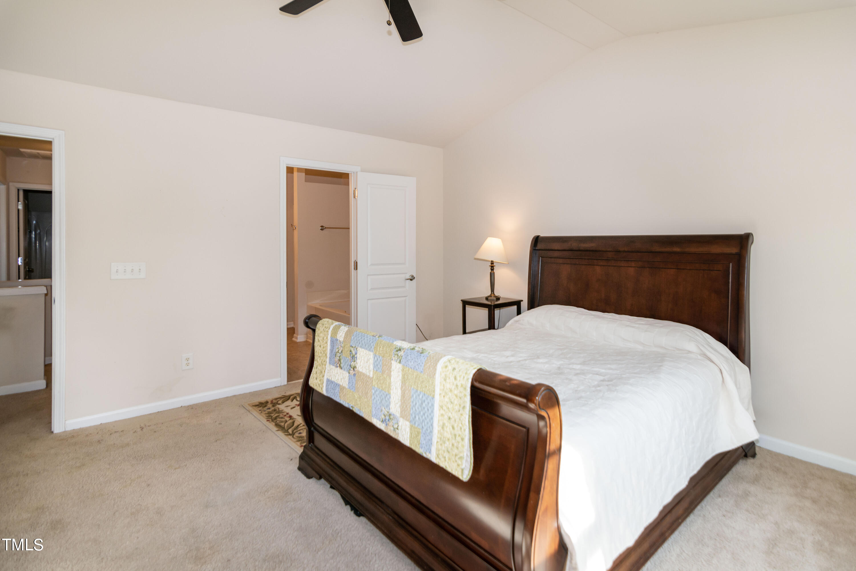 8621 Thunderwood Drive Raleigh, NC 27617 - Photo 19 of 35 a bed sitting in a bedroom next to a window