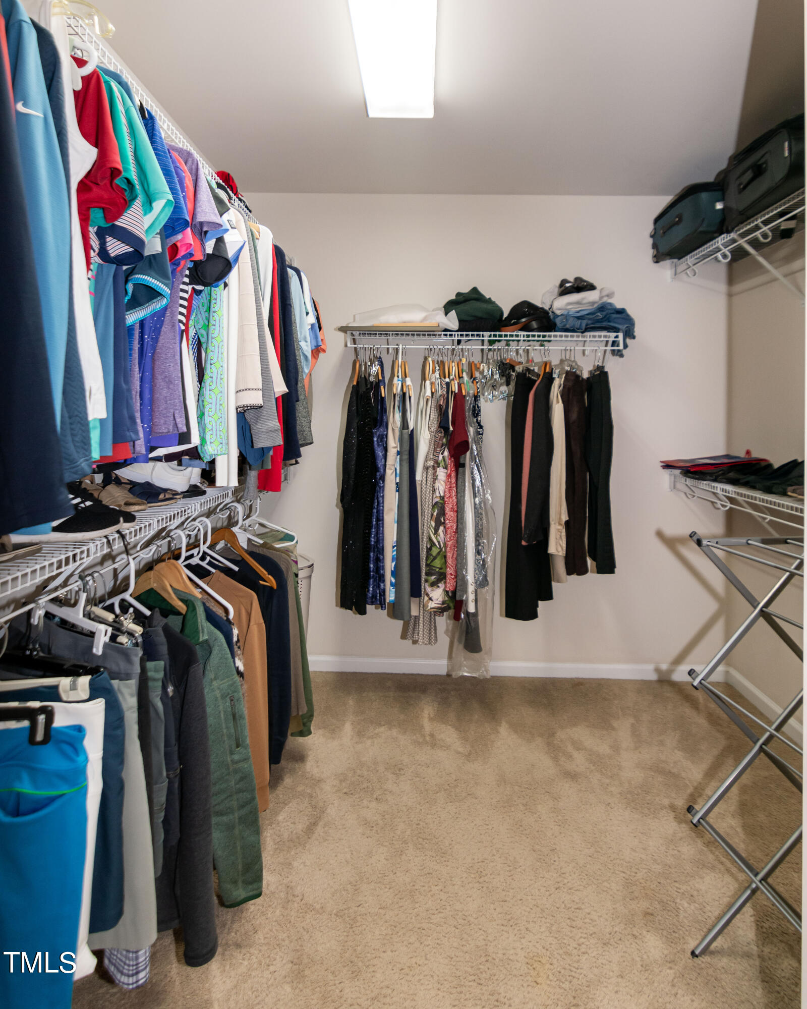 8621 Thunderwood Drive Raleigh, NC 27617 - Photo 23 of 35 a view of walk in closet with clothes