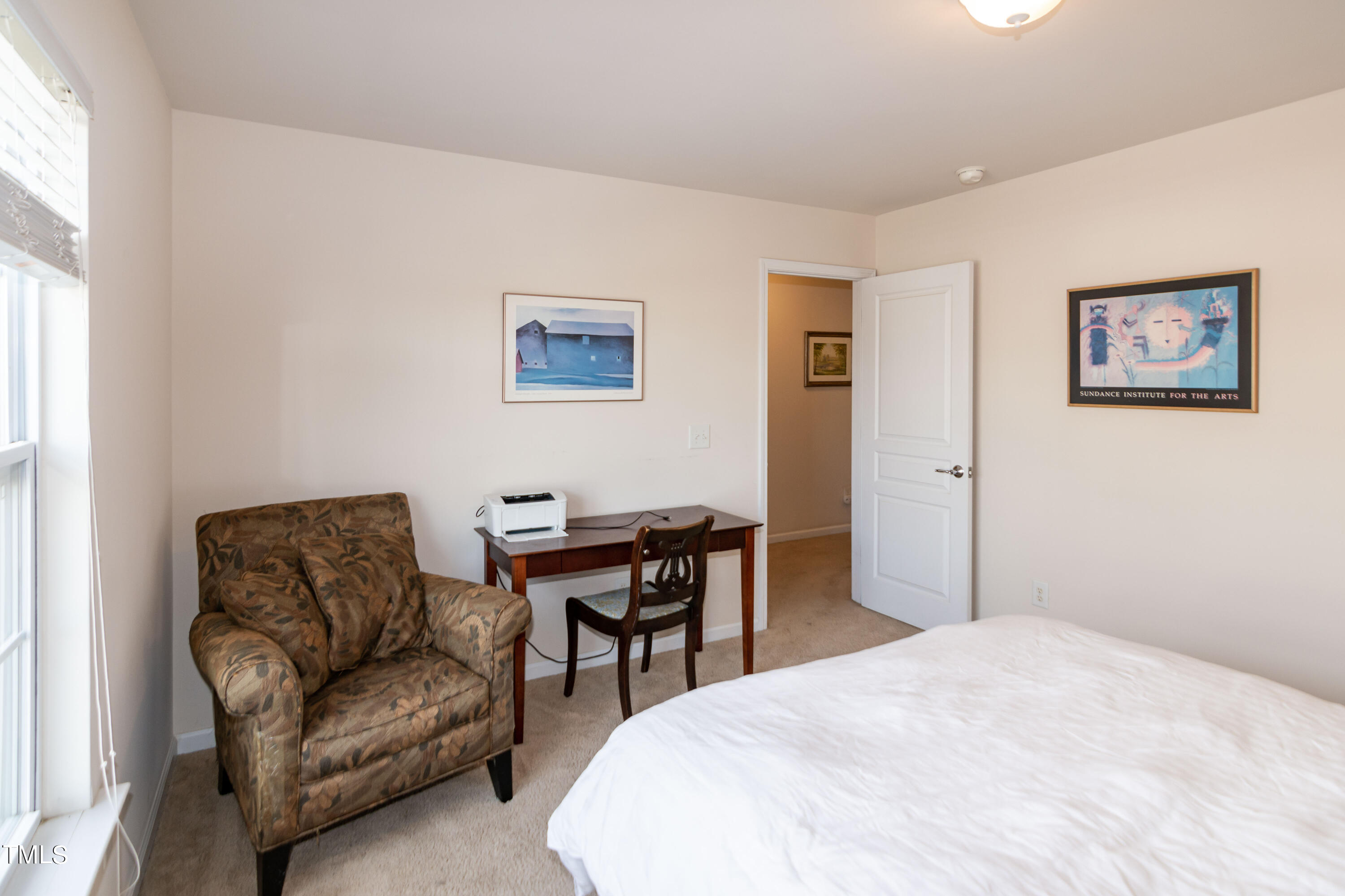 8621 Thunderwood Drive Raleigh, NC 27617 - Photo 26 of 35 a bedroom with a bed and a couch