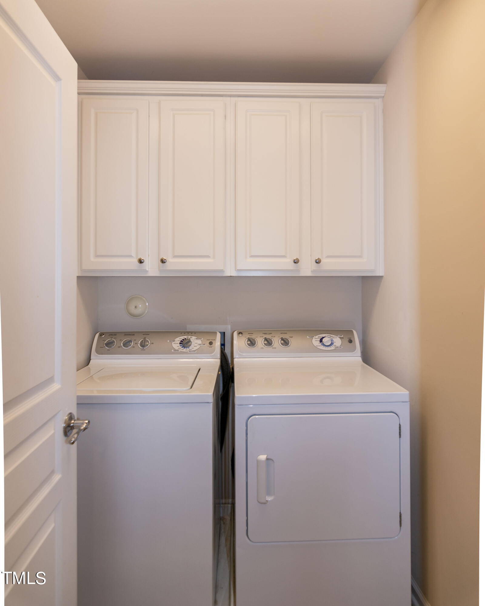 8621 Thunderwood Drive Raleigh, NC 27617 - Photo 30 of 35 a view of storage and utility room with washer and dryer