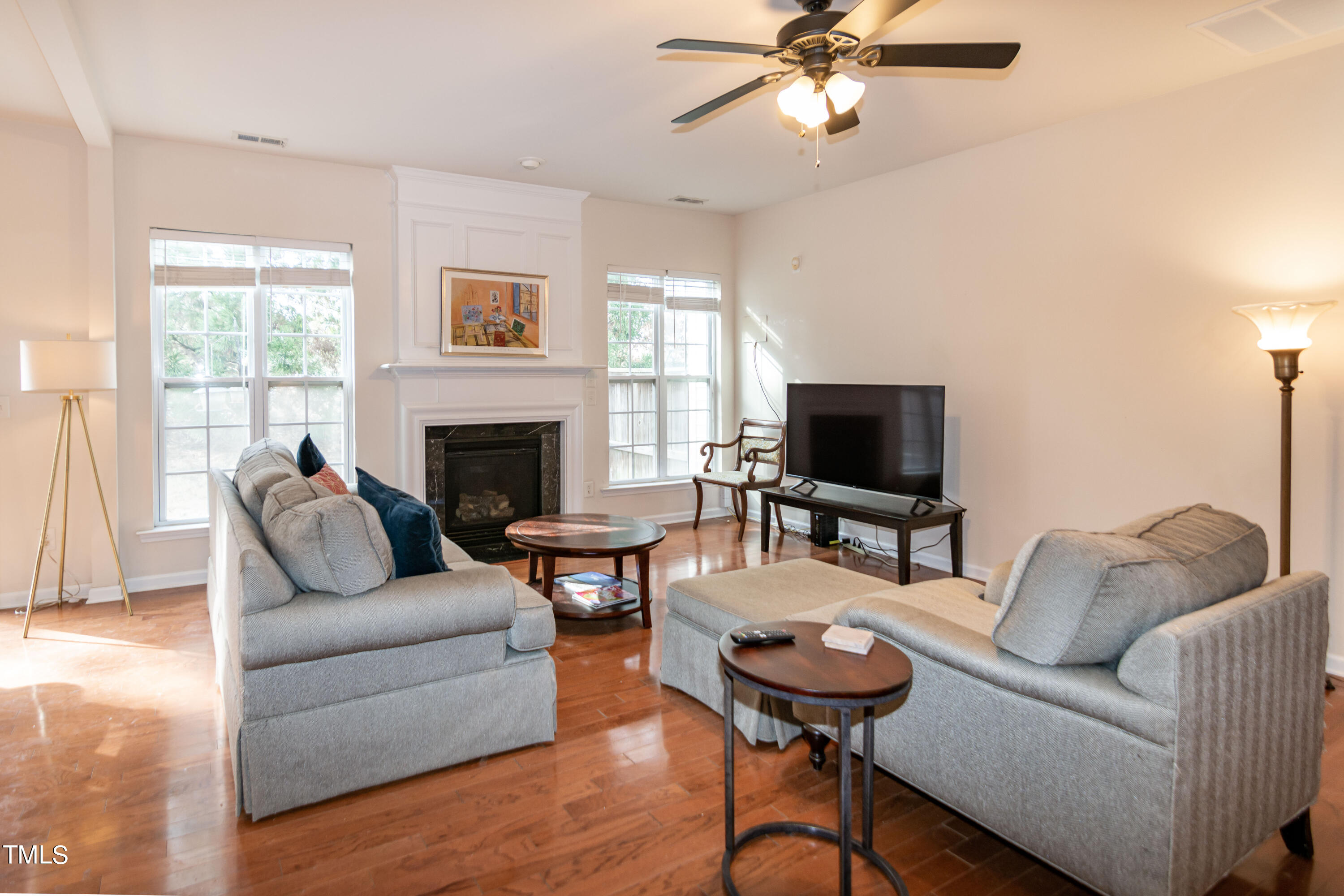 8621 Thunderwood Drive Raleigh, NC 27617 - Photo 6 of 35 a living room with furniture and a fireplace