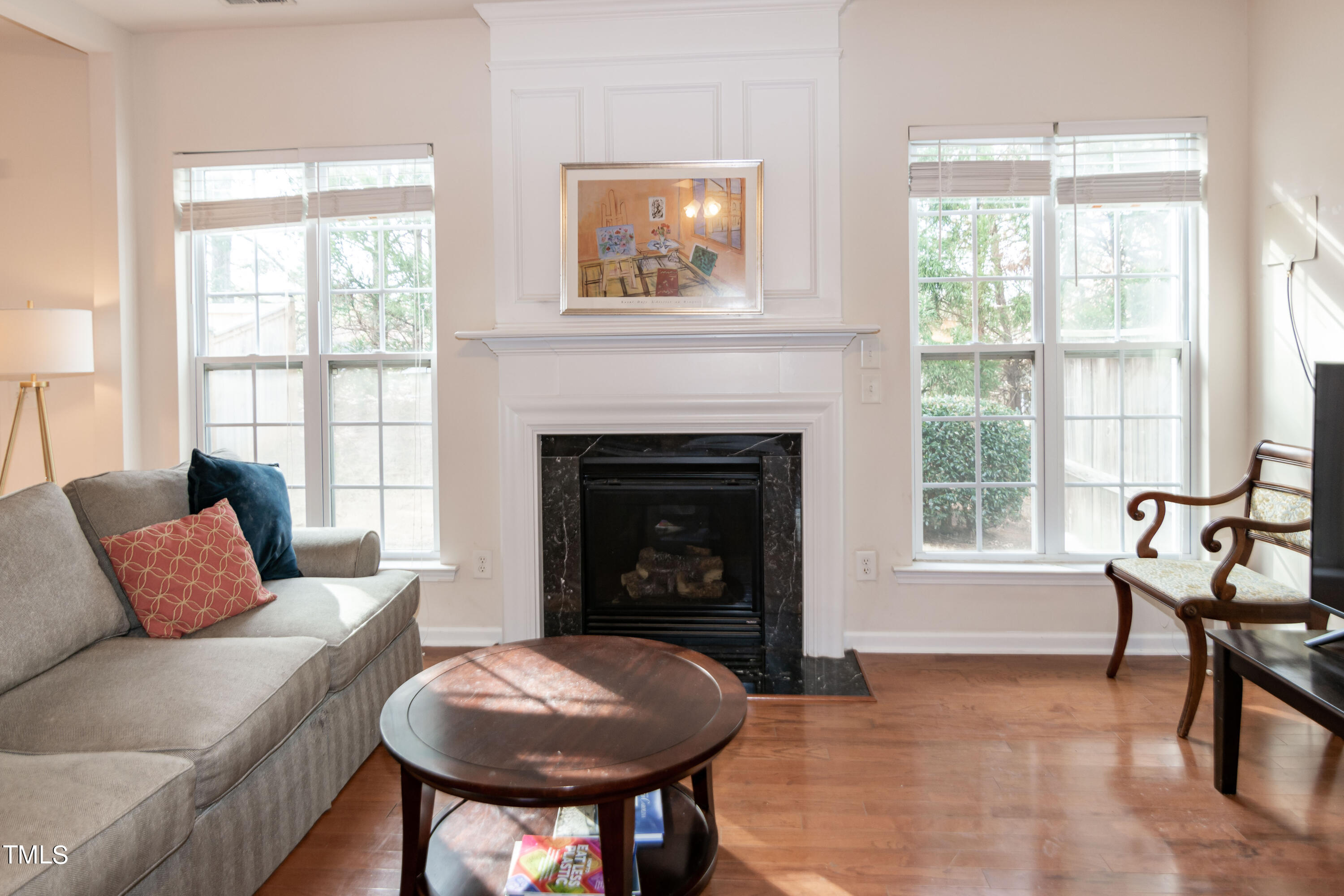 8621 Thunderwood Drive Raleigh, NC 27617 - Photo 8 of 35 a living room with furniture and a fireplace