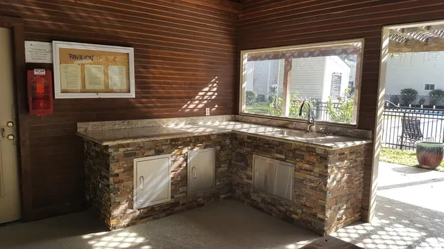 a kitchen with a stove and a sink