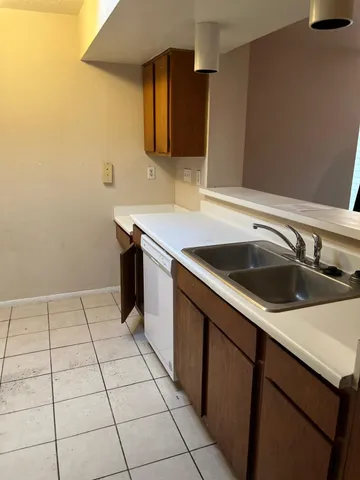 a kitchen with a sink and cabinets