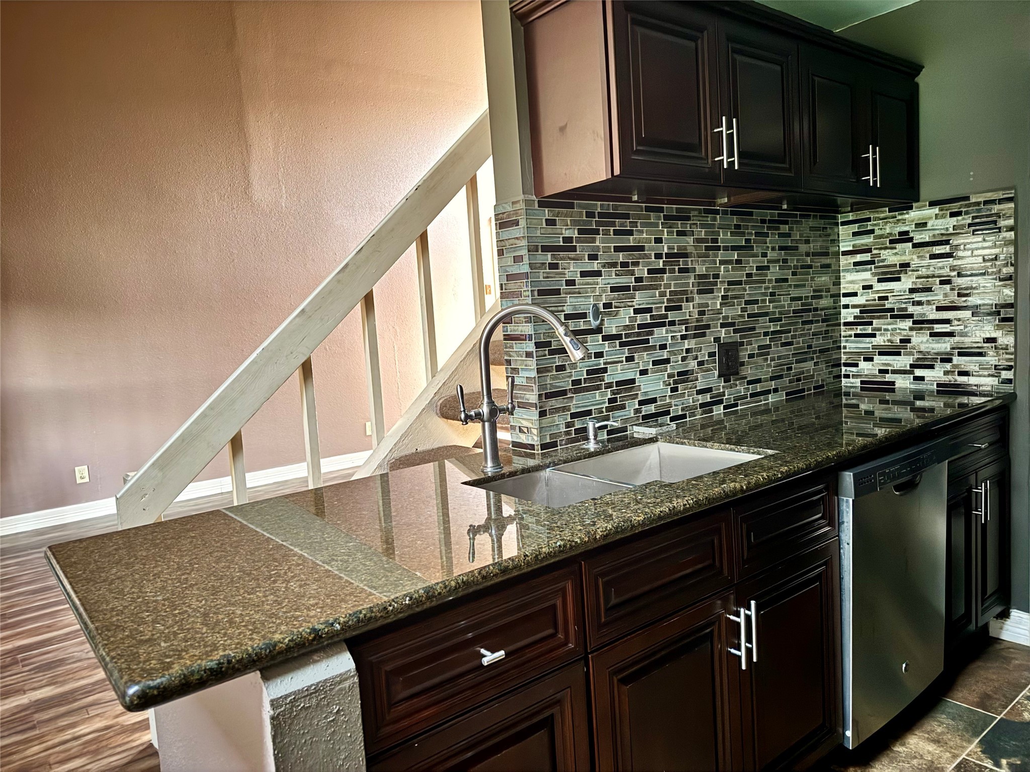 8275 Sands Point Drive, Unit 176 Houston, TX 77036 - Photo 23 of 31 a kitchen with a sink and cabinets