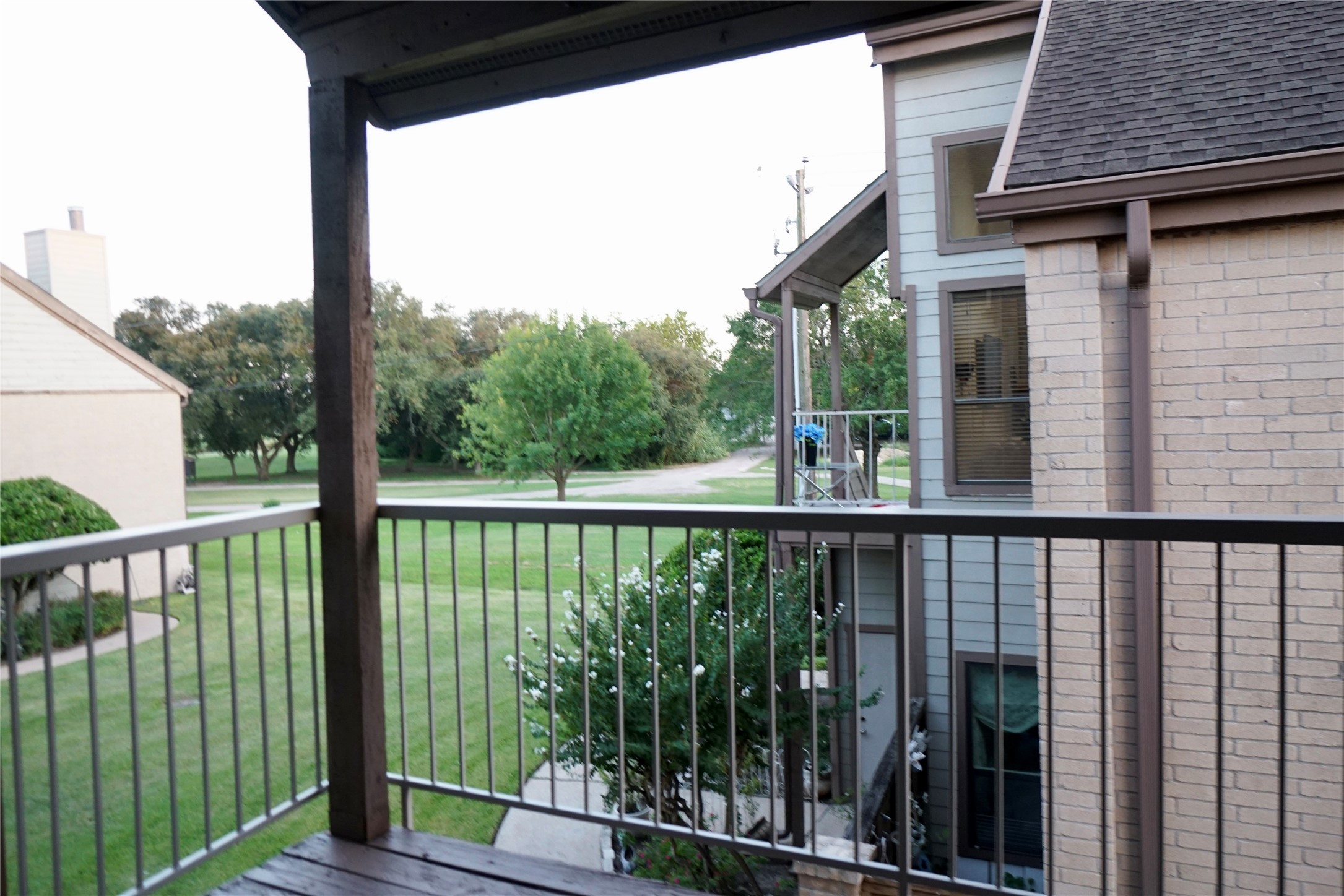8275 Sands Point Drive, Unit 176 Houston, TX 77036 - Photo 26 of 31 a view of a balcony with a floor to ceiling window