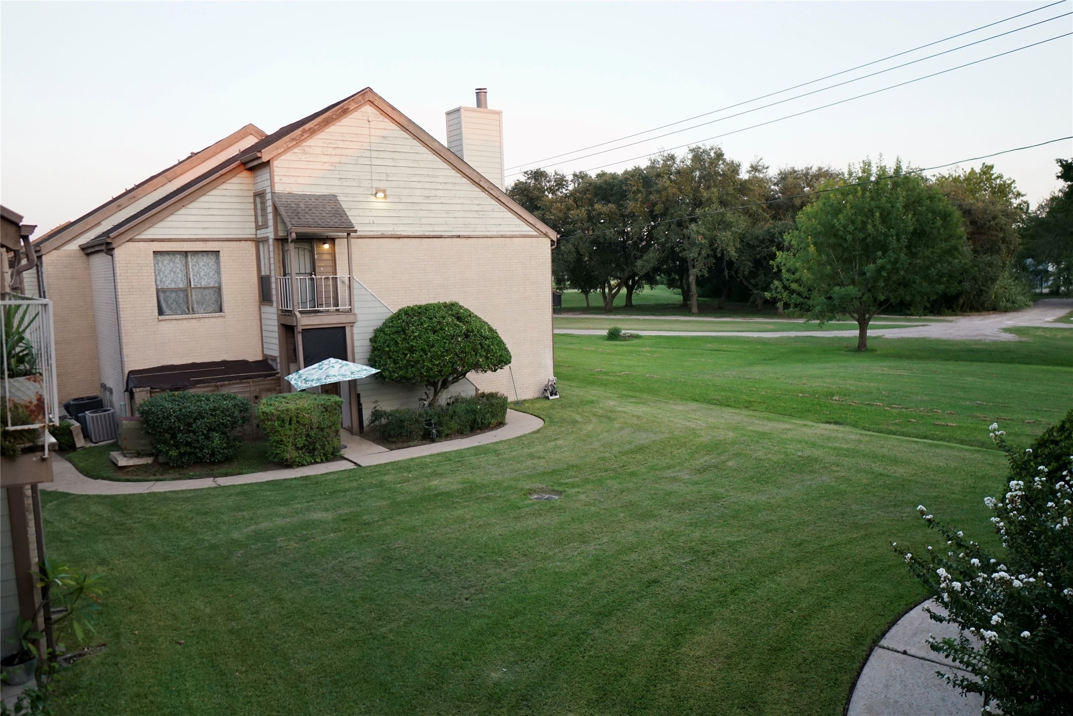 8275 Sands Point Drive, Unit 176 Houston, TX 77036 - Photo 28 of 31 a front view of a house with garden