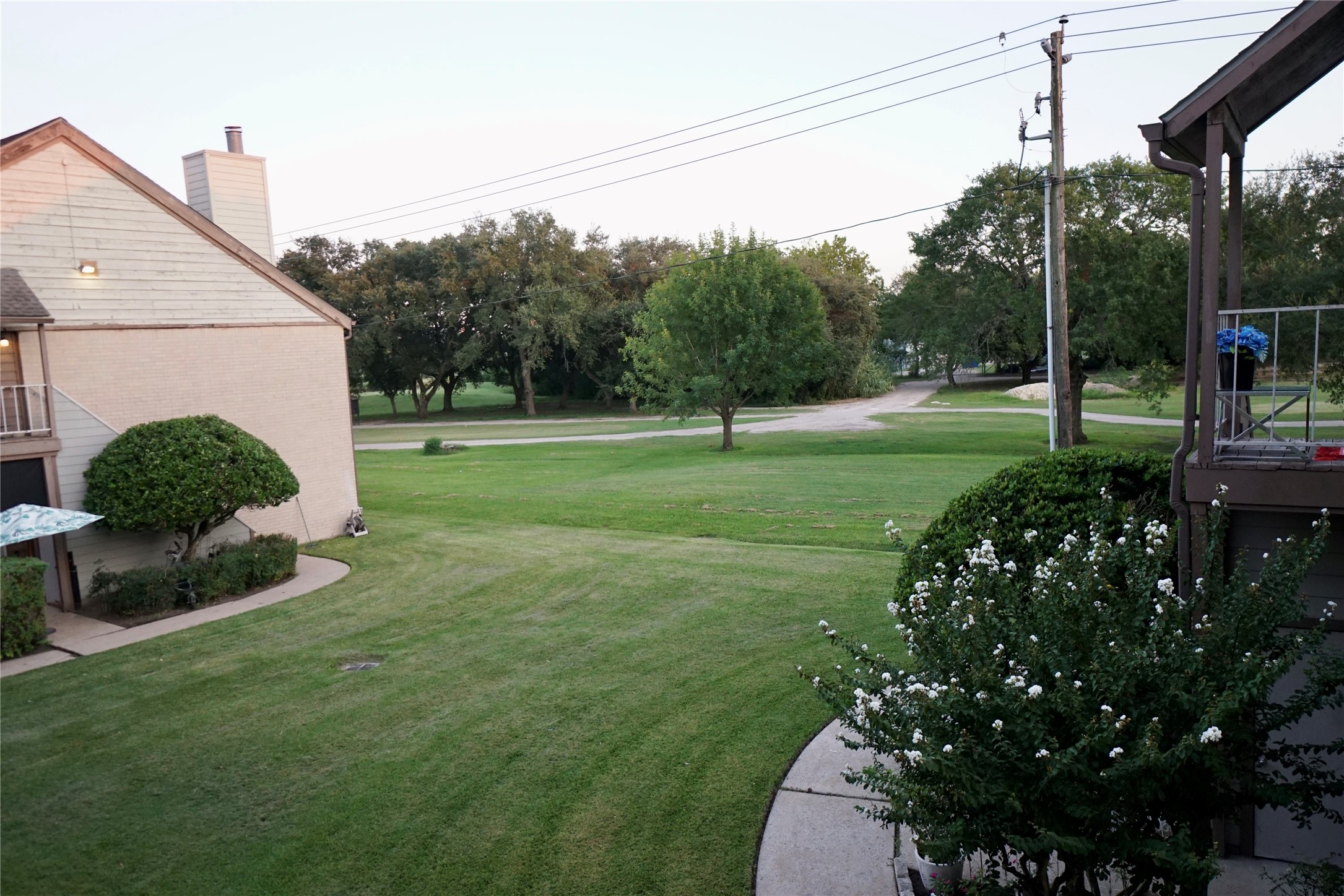 8275 Sands Point Drive, Unit 176 Houston, TX 77036 - Photo 9 of 31 a backyard of a house with lots of green space