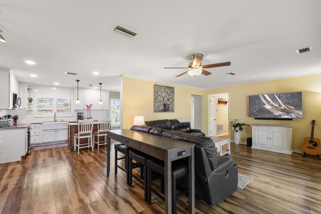 7133 Augusta Boulevard Seminole, FL 33777 - Photo 13 of 54 a view of a dining room with furniture and wooden floor