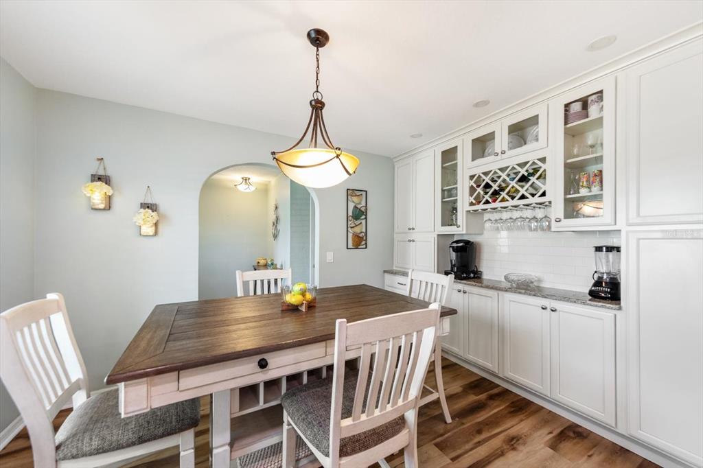 7133 Augusta Boulevard Seminole, FL 33777 - Photo 14 of 54 a view of a dining room with furniture and a chandelier