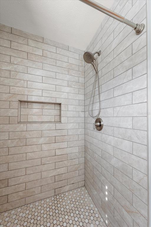 7133 Augusta Boulevard Seminole, FL 33777 - Photo 26 of 54 a bathroom with a shower