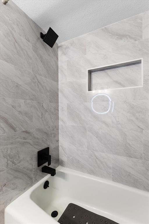 7133 Augusta Boulevard Seminole, FL 33777 - Photo 27 of 54 a bathroom with a tub