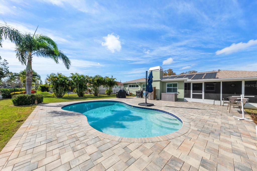 7133 Augusta Boulevard Seminole, FL 33777 - Photo 32 of 54 a view of a house with swimming pool and sitting area