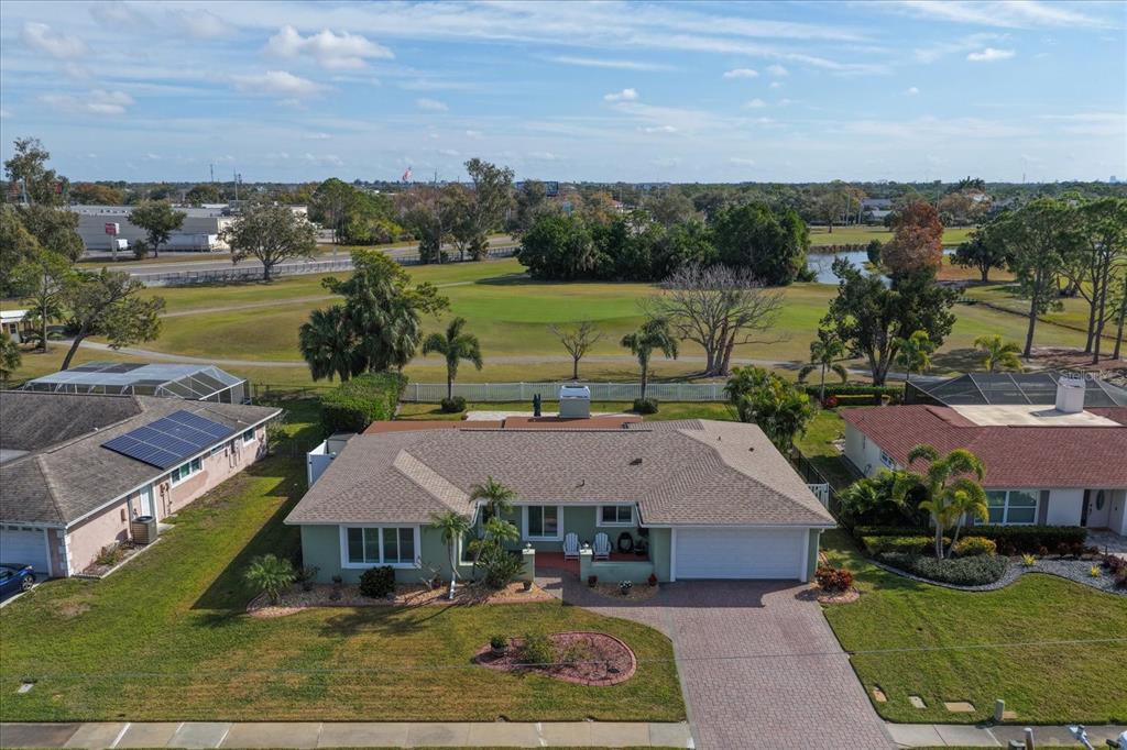 7133 Augusta Boulevard Seminole, FL 33777 - Photo 35 of 54 an aerial view of a house with garden space and lake view