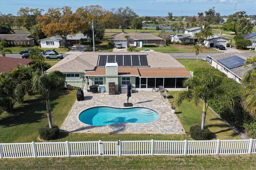 7133 Augusta Boulevard Seminole, FL 33777 - Photo 39 of 54 a front view of a house with a garden