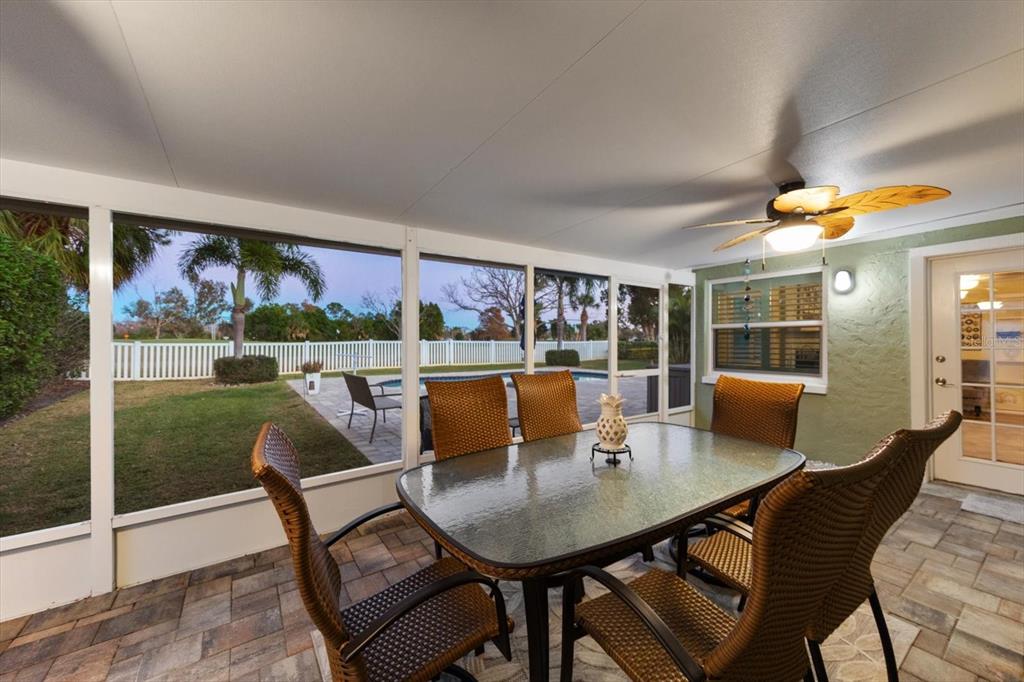 7133 Augusta Boulevard Seminole, FL 33777 - Photo 54 of 54 a view of a dining room with furniture and a floor to ceiling window