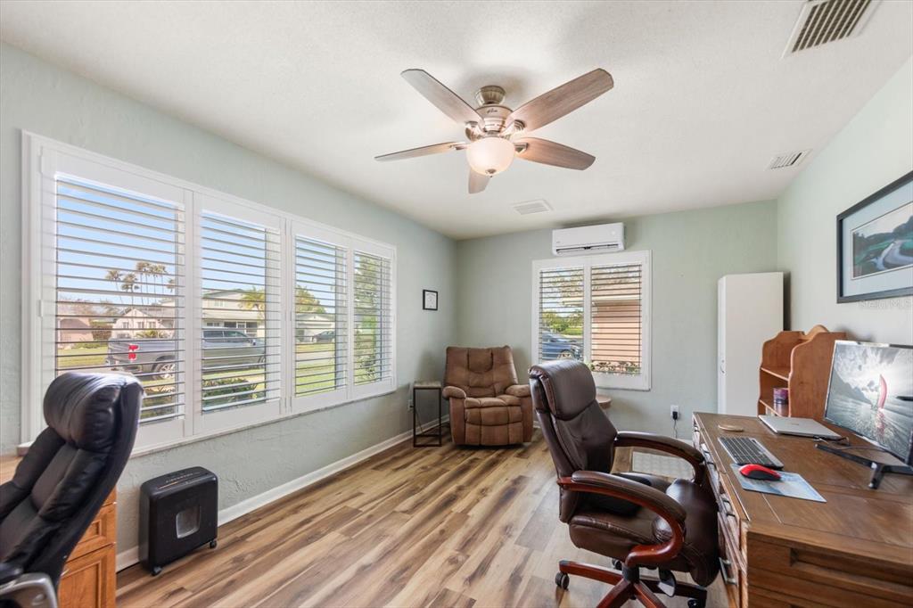 7133 Augusta Boulevard Seminole, FL 33777 - Photo 6 of 54 a view of a livingroom with workspace and a window