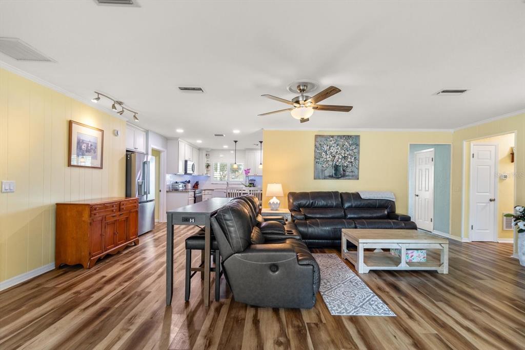 7133 Augusta Boulevard Seminole, FL 33777 - Photo 8 of 54 a living room with furniture and wooden floor