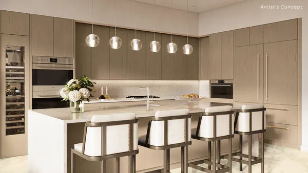 a kitchen with a table chairs and entryway