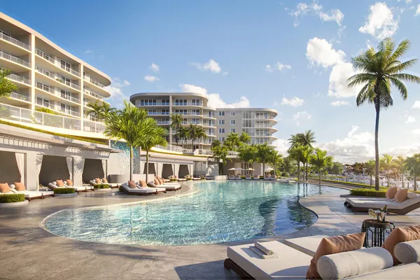 a view of a swimming pool with outdoor seating