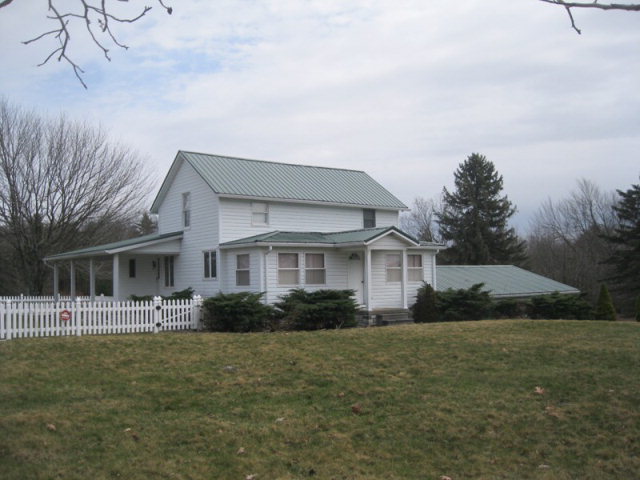 3960 Miola Road Clarion, PA 16214 - Photo 1 of 1 a front view of house with yard and green space