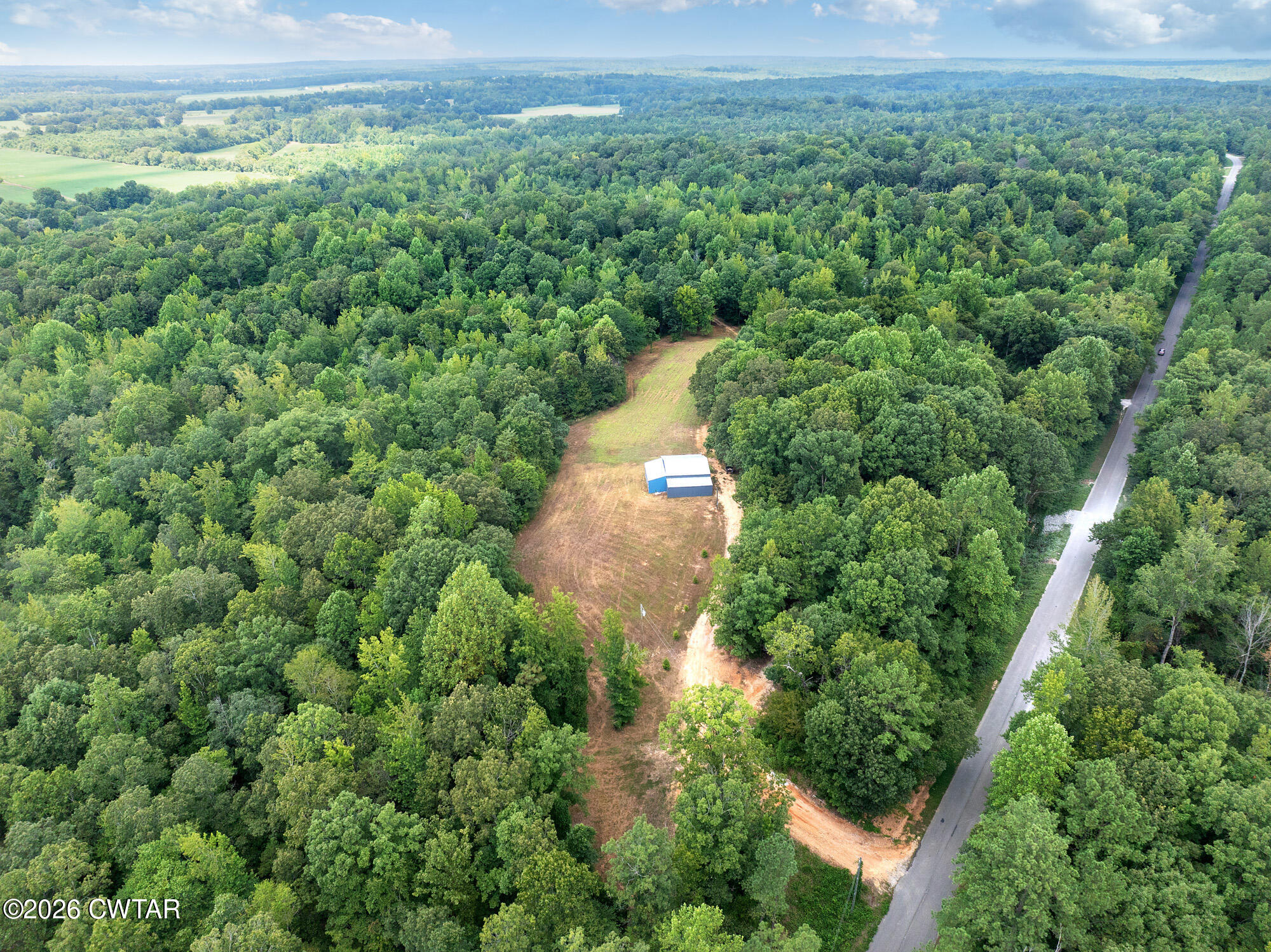 957 Holladay Road Parsons, TN 38363 - Photo 18 of 25 DJI_20250809132033_0933_D