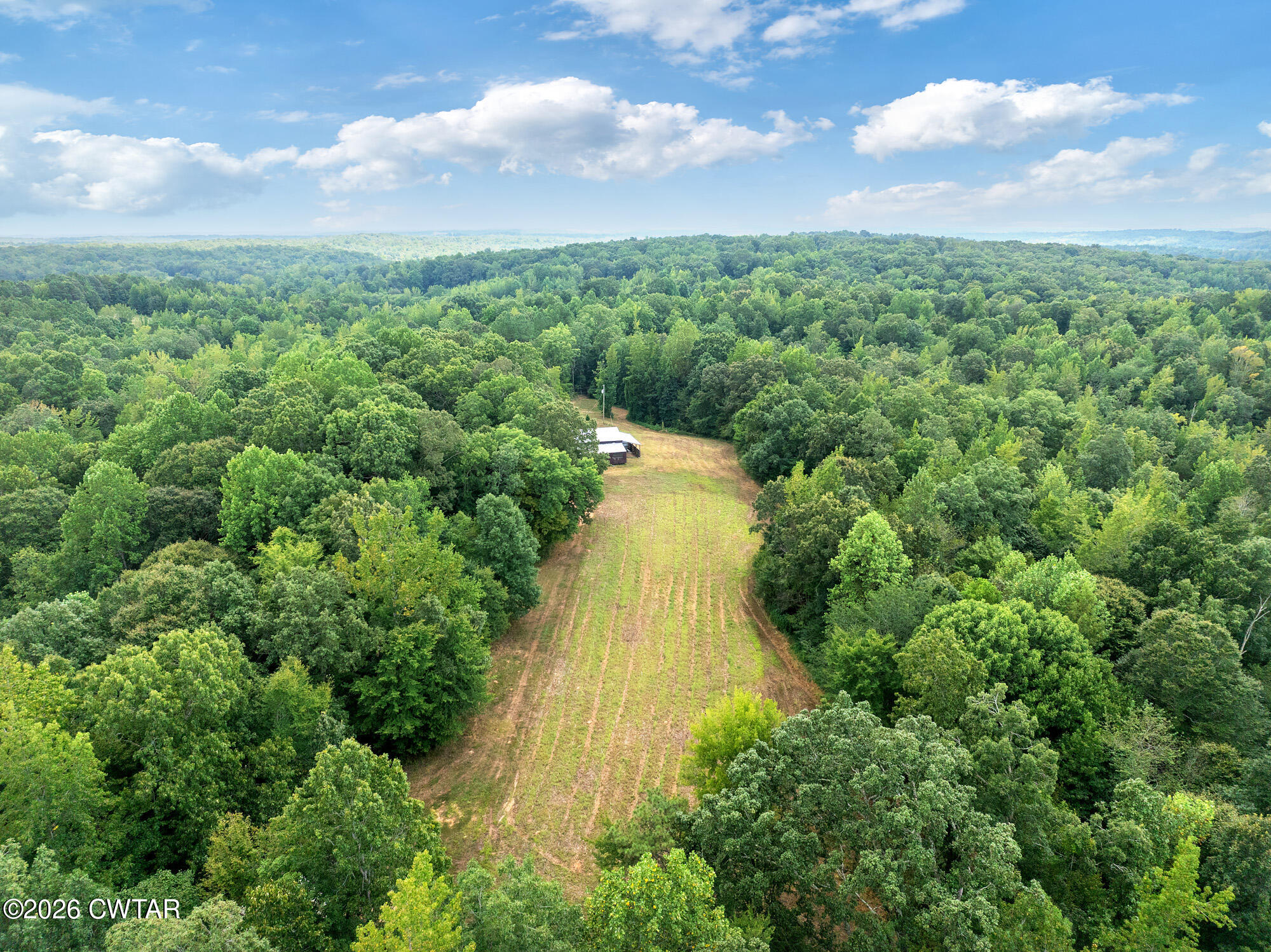 957 Holladay Road Parsons, TN 38363 - Photo 3 of 25 DJI_20250809131913_0932_D (1)