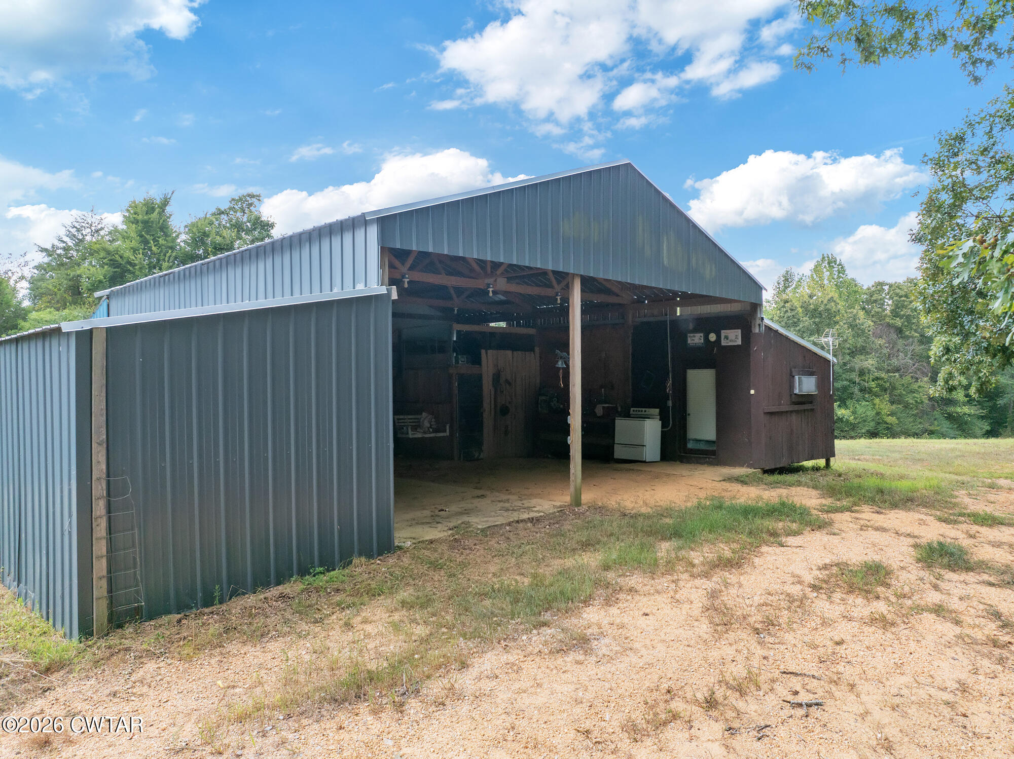 957 Holladay Road Parsons, TN 38363 - Photo 5 of 25 DJI_20250809131642_0926_D