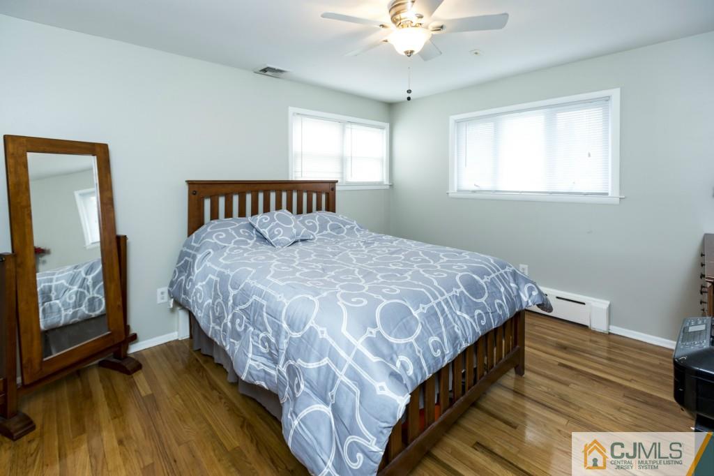 106 Normandy Road Colonia, NJ 07067 - Photo 17 of 25 a bedroom with a bed and a window