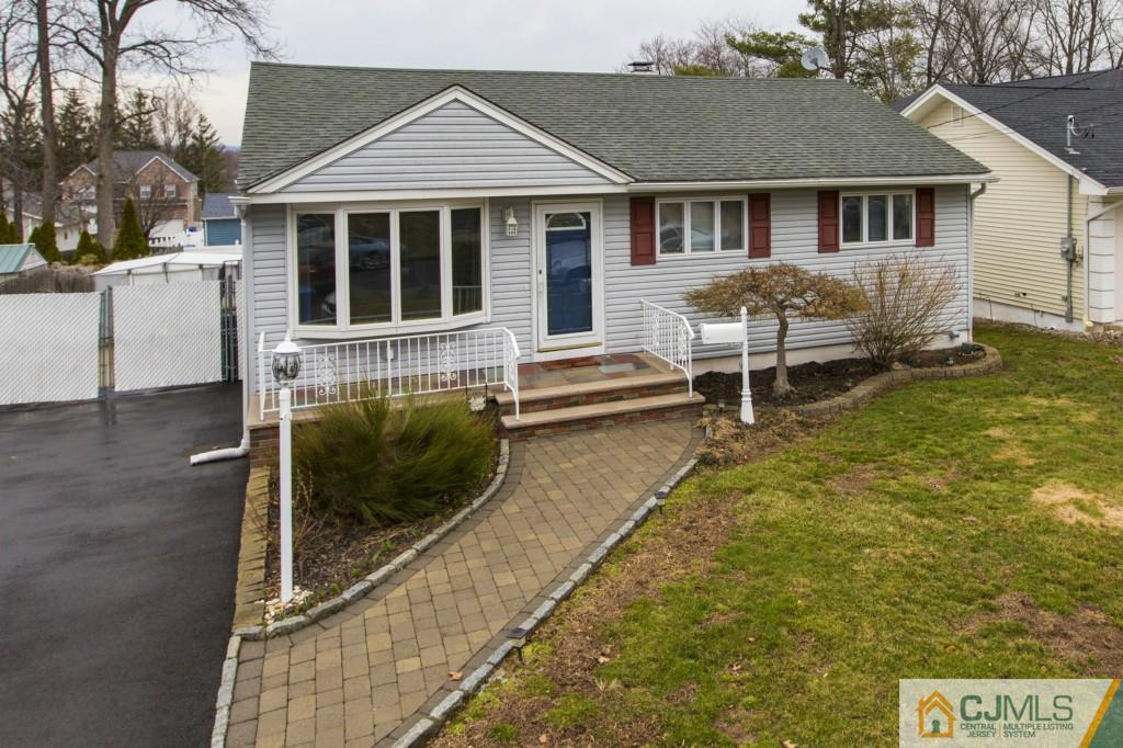 106 Normandy Road Colonia, NJ 07067 - Photo 4 of 25 a view of house with a yard and sitting area