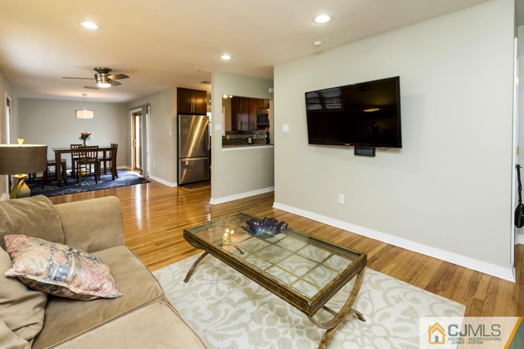 106 Normandy Road Colonia, NJ 07067 - Photo 7 of 25 a living room with furniture and a flat screen tv
