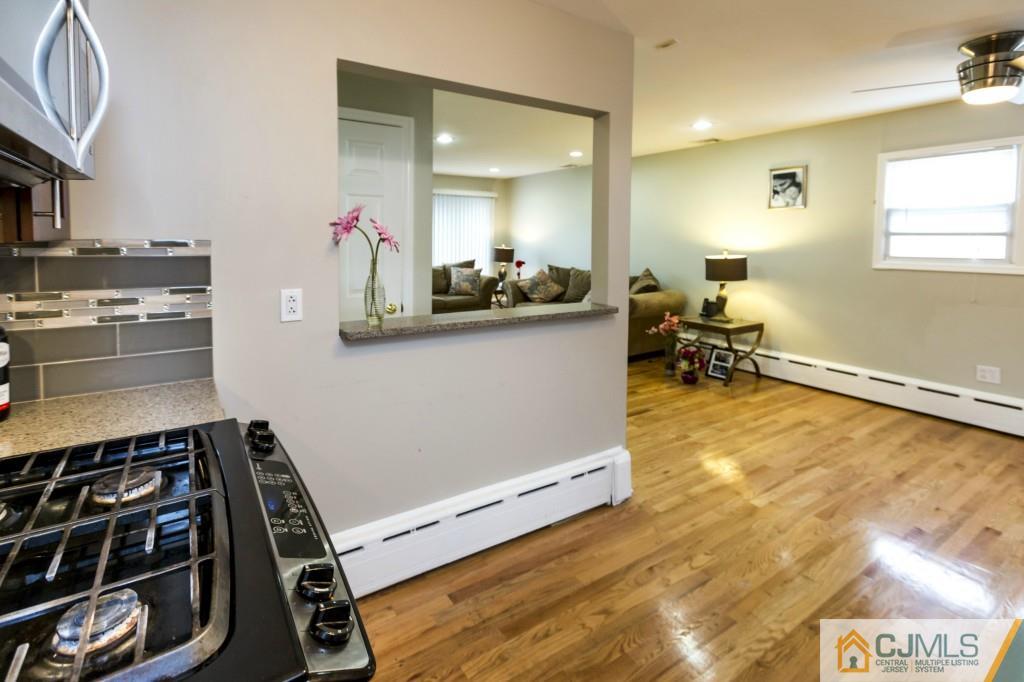 106 Normandy Road Colonia, NJ 07067 - Photo 10 of 25 a kitchen with a sink and a stove top oven