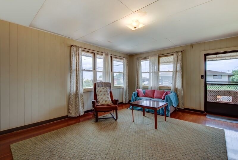 4770 Moi Road Hanapepe, HI 96716 - Photo 5 of 11 a living room with furniture a rug and a window
