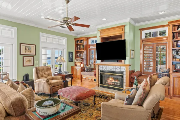 a living room with fireplace furniture and a flat screen tv
