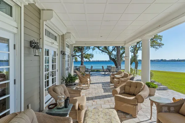 a outdoor space with patio the couches and pool table with chairs