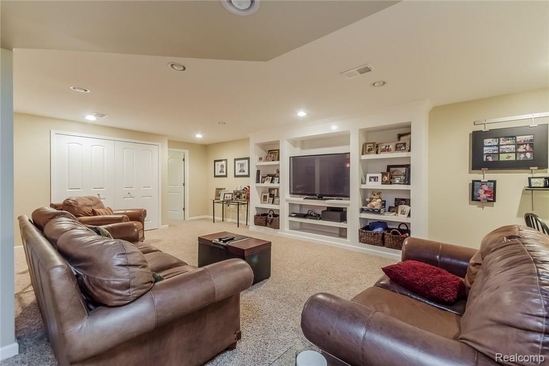 2178 Reagan Drive Rochester, MI 48309 - Photo 30 of 44 Lots of storage shelving plus Couch stays!
