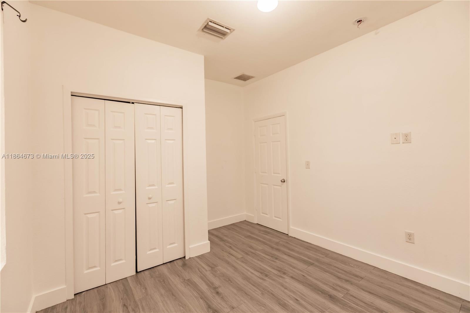 445 Northwest 77th Street, Unit 445 Miami, FL 33150 - Photo 14 of 20 a view of an empty room