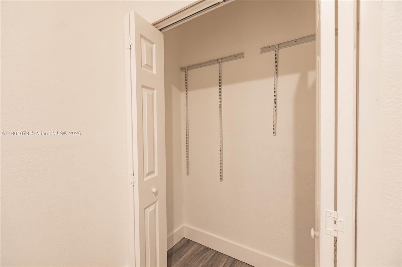 445 Northwest 77th Street, Unit 445 Miami, FL 33150 - Photo 18 of 20 a bathroom with a glass shower door