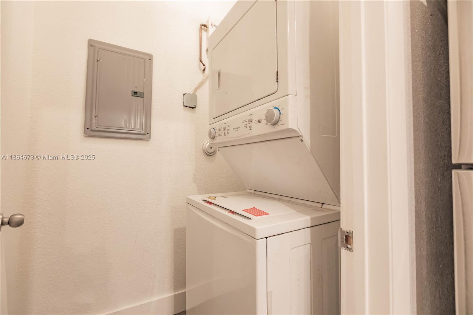 445 Northwest 77th Street, Unit 445 Miami, FL 33150 - Photo 20 of 20 a utility room with dryer and washer