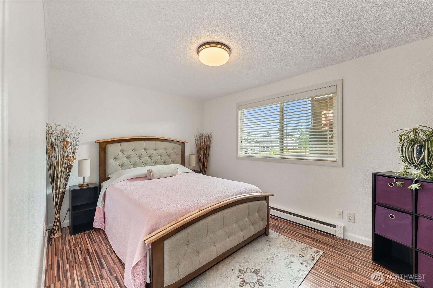 10107 Meridian Avenue Everett, WA 98208 - Photo 13 of 26 a bedroom with a bed and a dresser